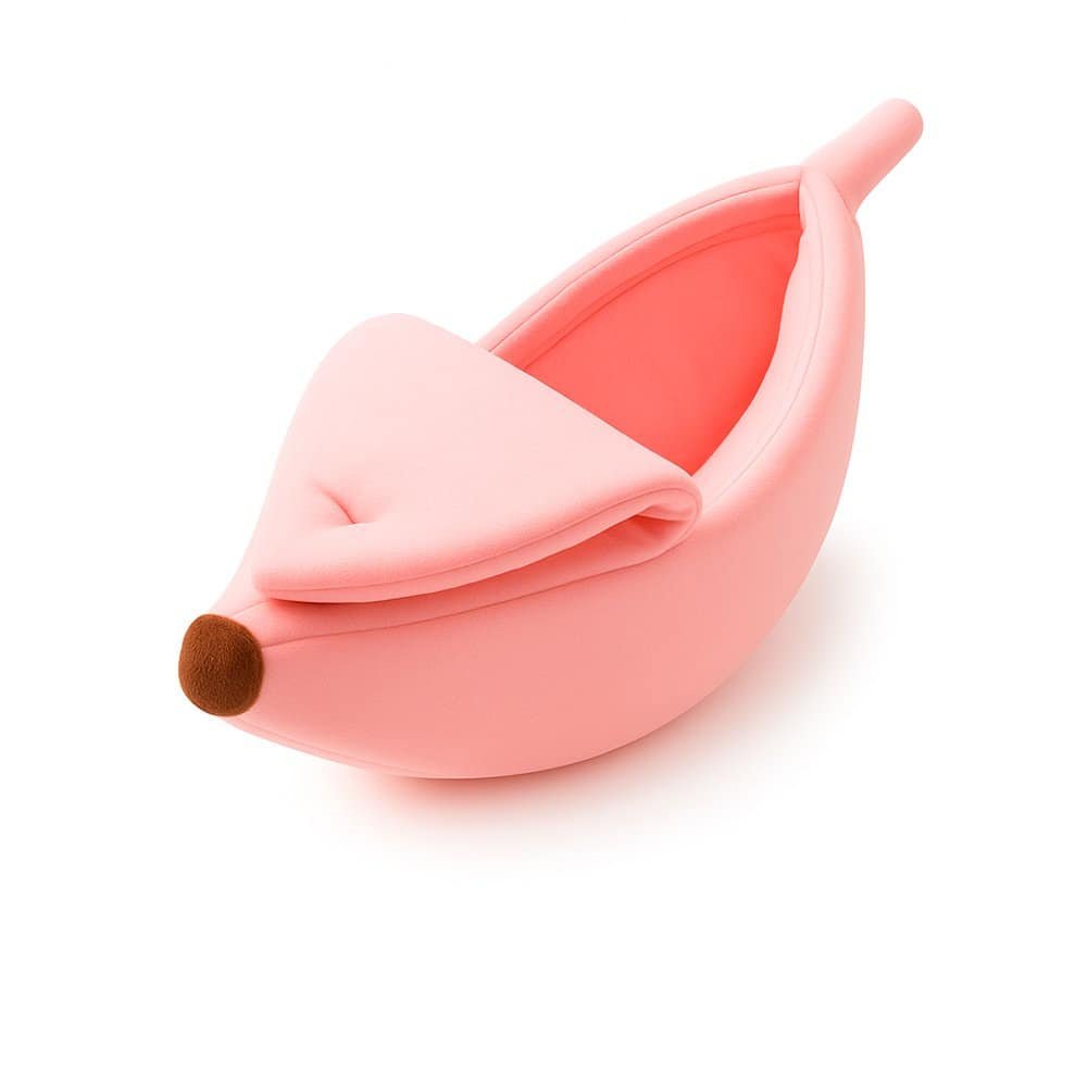 Pink banana-shaped pet bed with soft interior for small cats